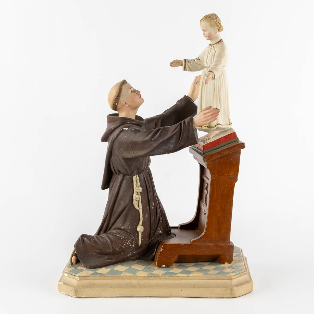 Saint Anthony with a child, polychrome plaster. Circa 1900. (L:20 x W:32 x H:44 cm)