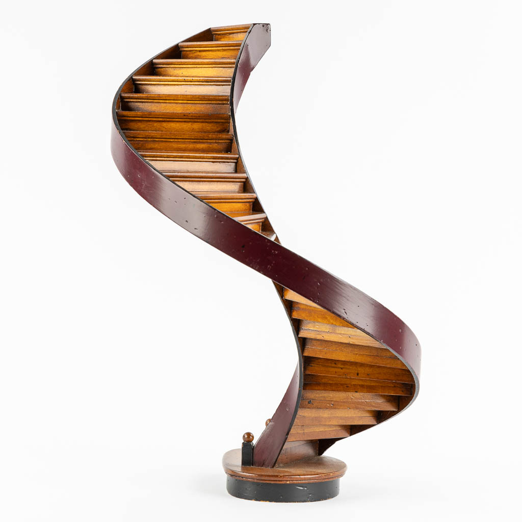 An architectural model of a revolving staircase, wood. 20th C. (H:47,5 x D:29 cm)