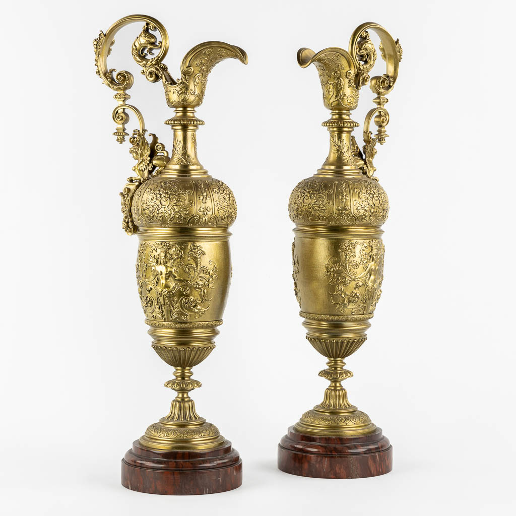 A large pair of pitchers, in the style of Ferdinand Barbedienne. 19th C. (L:15 x W:21 x H:59 cm)