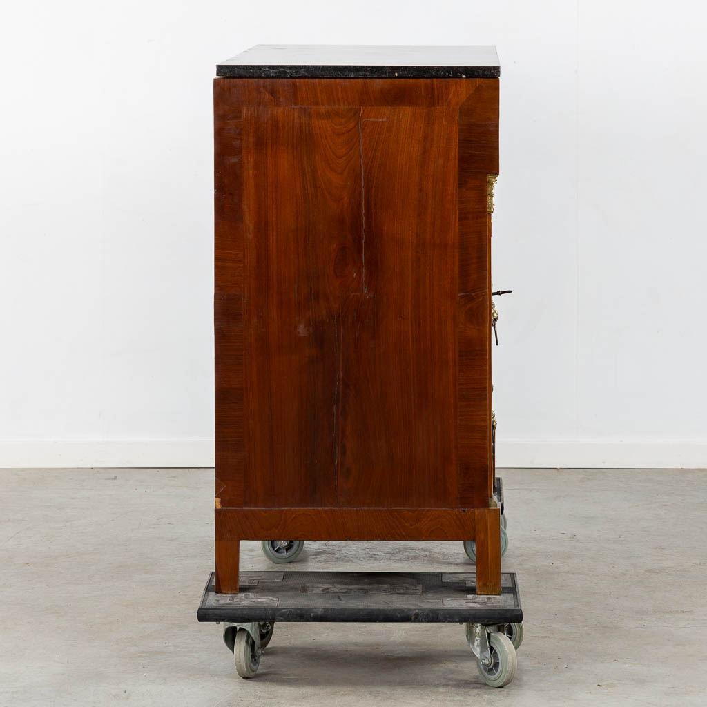 A four-drawer commode mounted with gilt bronze and a marble top, Empire. (L:53 x W:125 x H:98 cm)