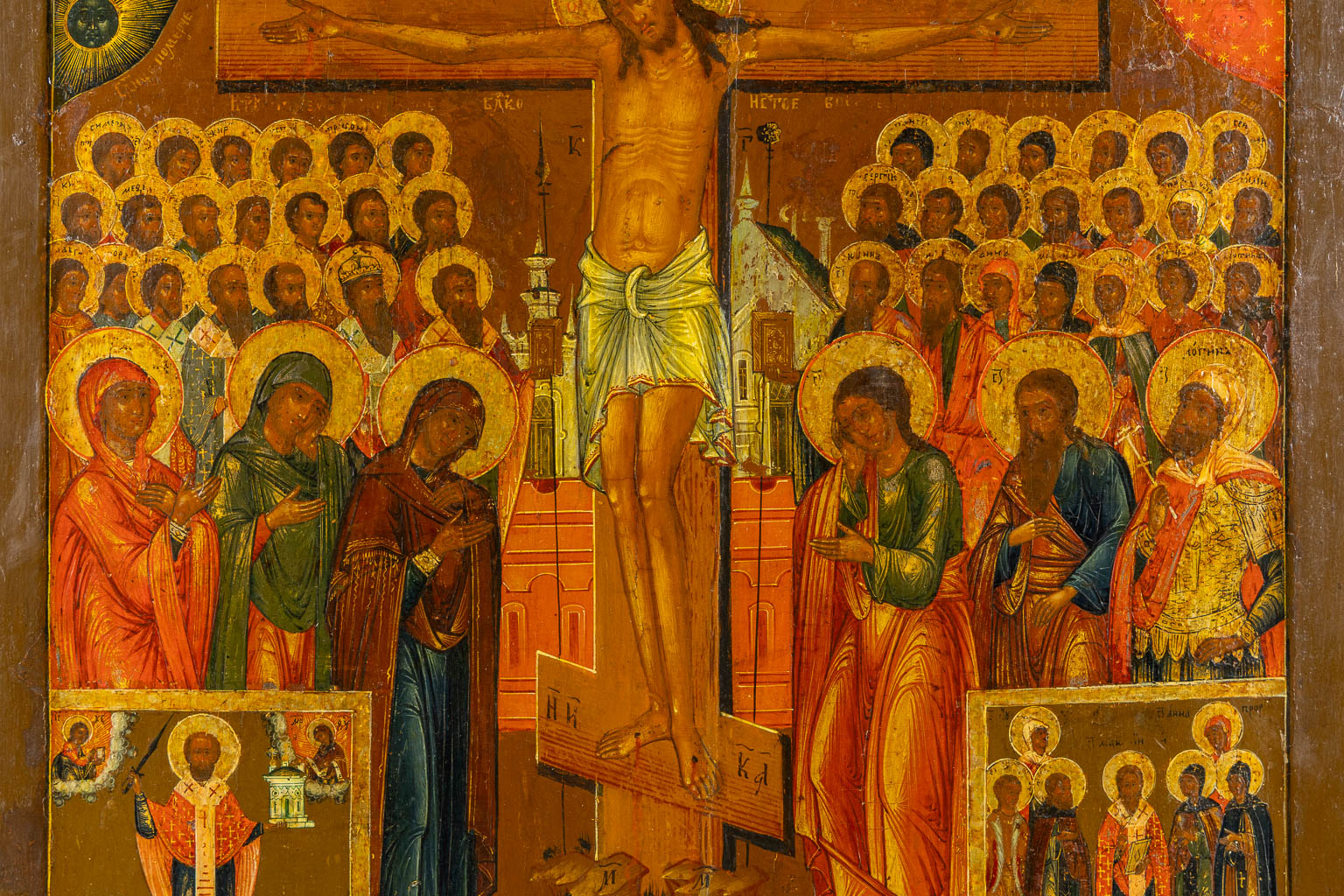 A Crucifixion Icon, Saint Nicholas, Mother God and various other saints. 19th C. (W:45,5 x H:53 cm)