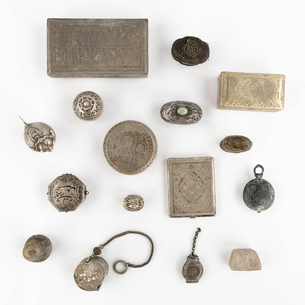 Fourteen Islamic and Indian Amulet or Trinklet boxes, Silver and silver-plate. 19th/20th C. (L:9,5 x W:16,5 x H:2,5 cm)