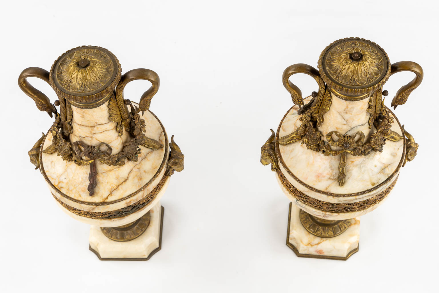 A pair of marble cassolettes, marble mounted with bronze in Louis XVI style. Ram