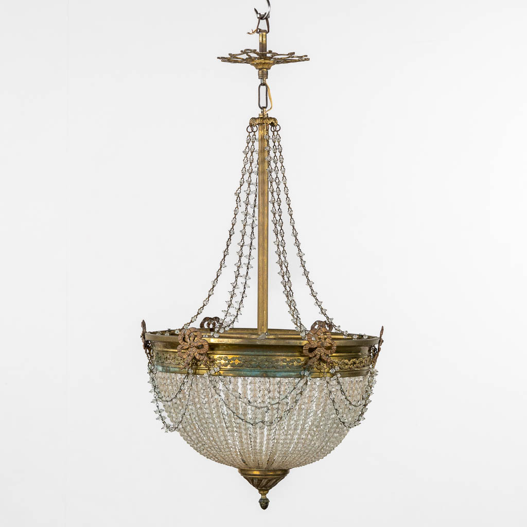 A 'Sac-à-Perles' chandelier, bronze and glass in a Louis XVI style. (H:76 x D:40 cm)