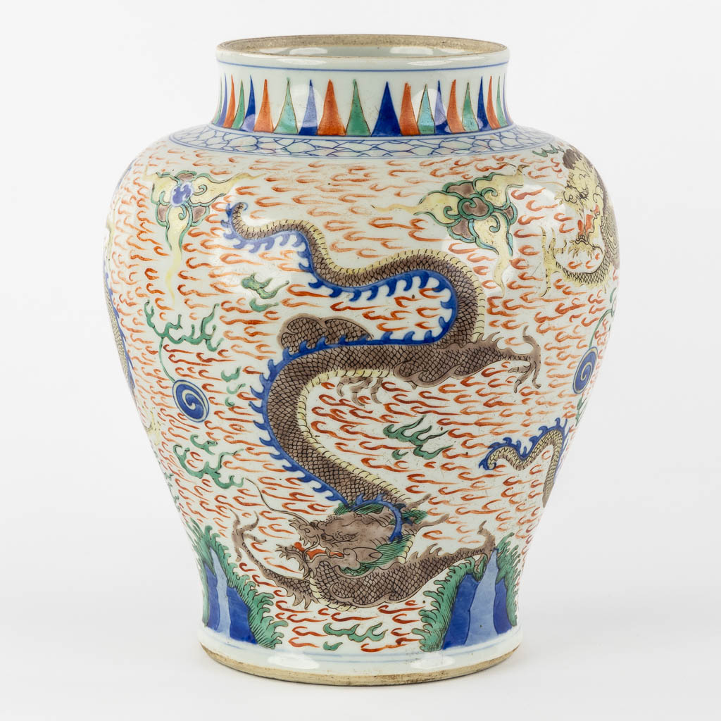 A Chinese Wucai vase with a dragon decor, 19th C.