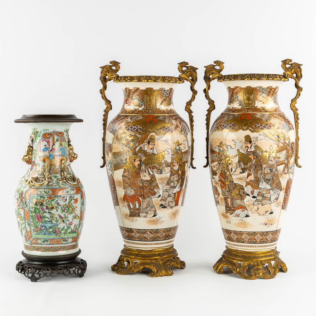 A pair of Japanese Kutani vases, mounted with bronze. Added a Chinese Canton vase. (L:24 x W:27 x H:56 cm)