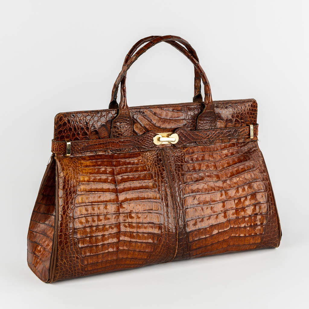 A vintage handbag, crocodile leather and gold-plated hardware. 