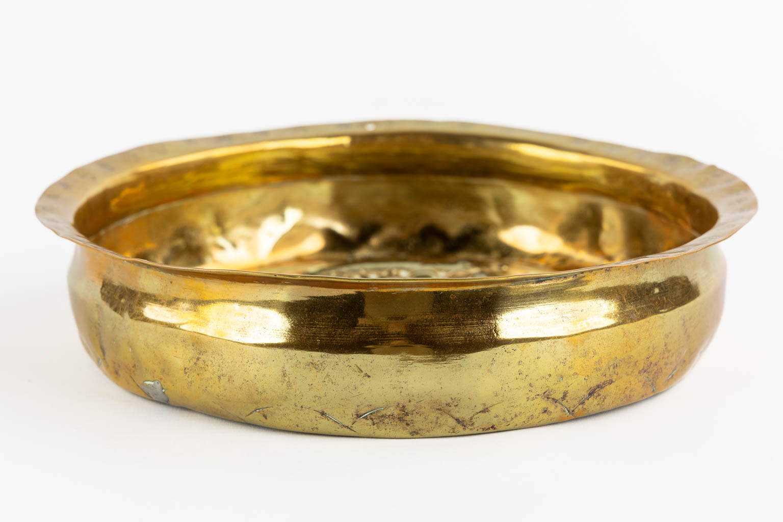 An antique Baptismal bowl, brass depicting 