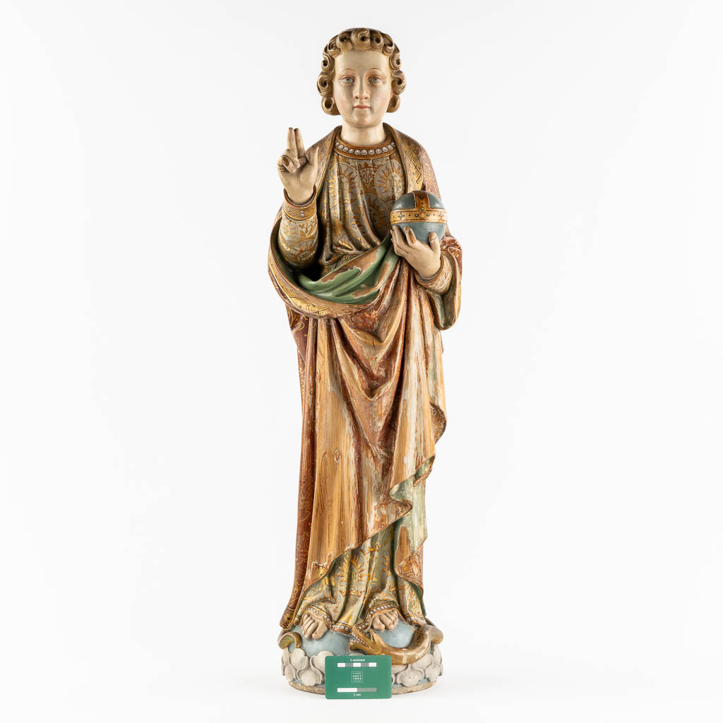 An antique wood-sculptured figurine of Salvator Mundi, holding a globus cruciger and serpent. 19th C. (L:22 x W:27 x H:87 cm)