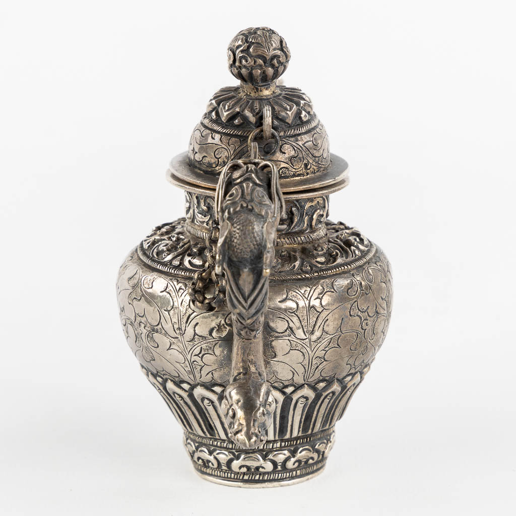 A small silver and Ceremonial teapot, Probably Tibet. (L:7 x W:12 x H:11,5 cm)