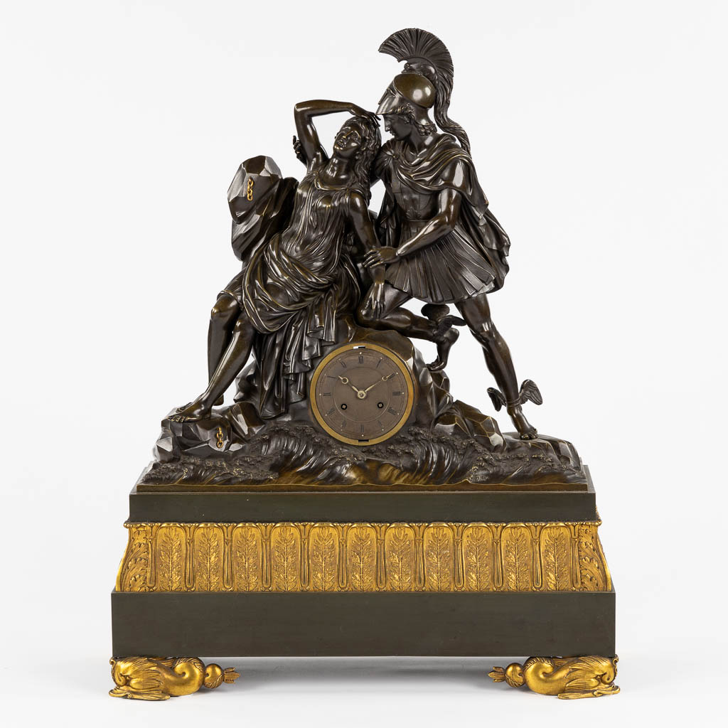 A large bi-coloured mantle clock 'The Liberation of Nimph Lo by Hermes, 19th C. (L:23 x W:65 x H:84 cm)