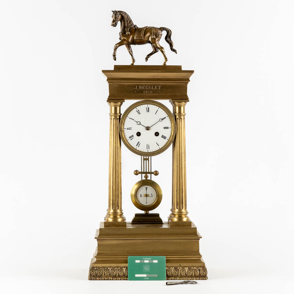 An antique column clock, bronze with a horse figurine. 19th C. (L:18 x W:27 x H:62 cm)