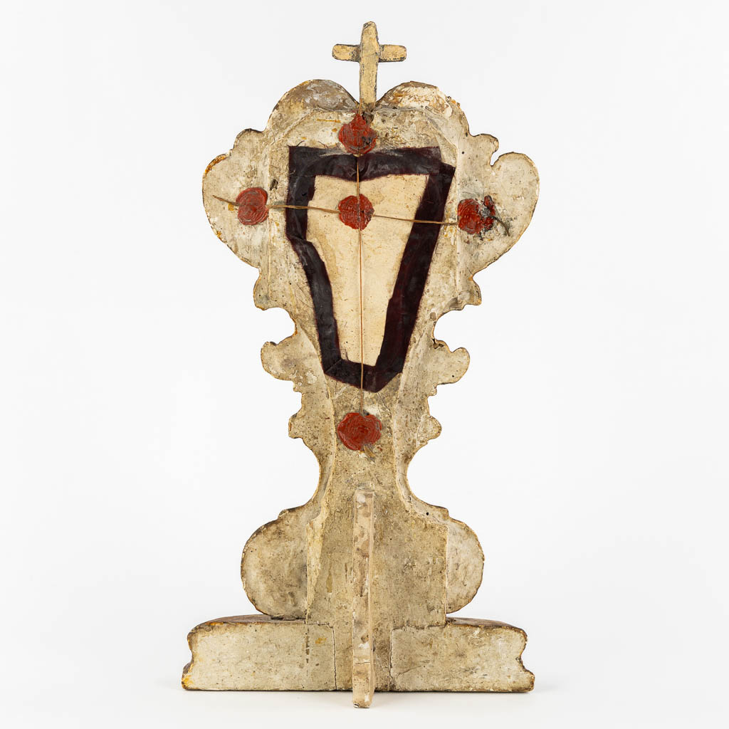 An antique wood-sculptured reliquary holder with a sealed relic of the true cross, Baroque, 18th C.