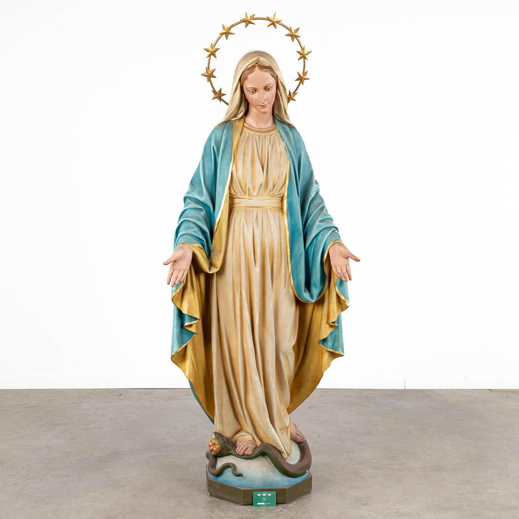 A lifesize figurine of Madonna trampling the Serpent, patinated plaster. Circa 1900. (D:43 x W:72 x H:183 cm)