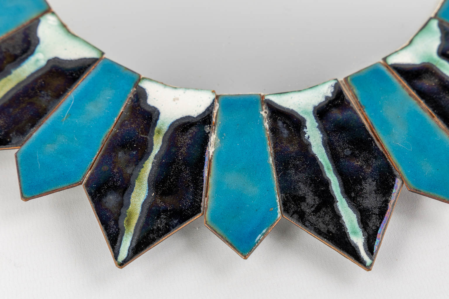 A mid-century Sunburst mirror, blue and black enamel on copper, glass. (D:31,5 cm)