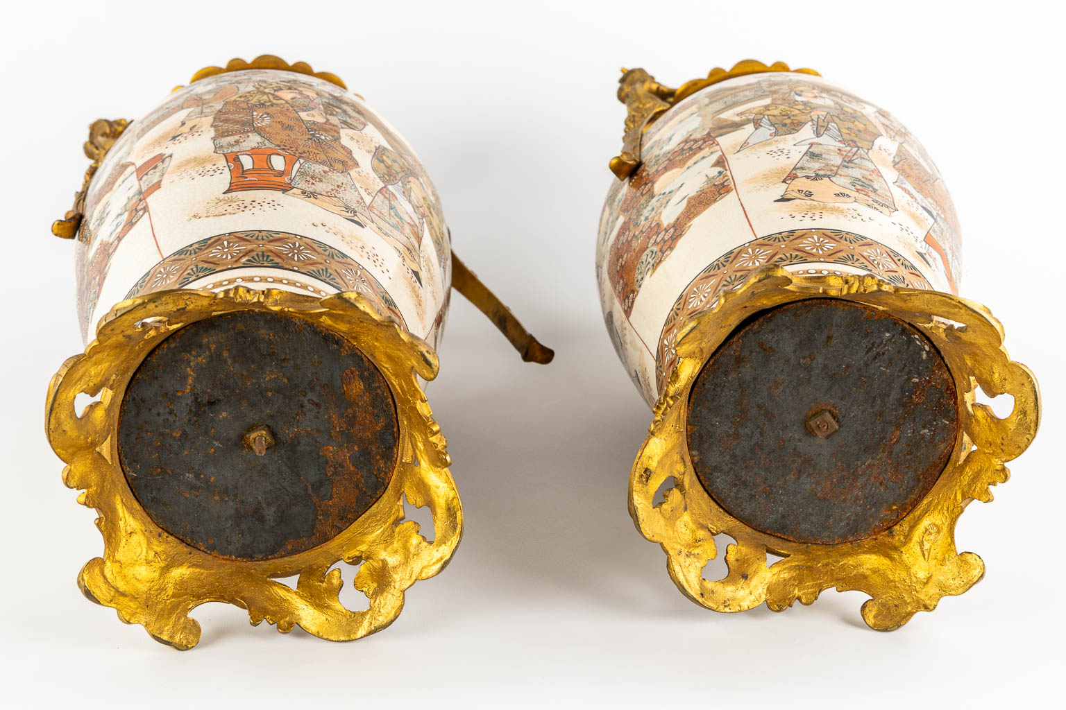 A pair of Japanese Kutani vases, mounted with bronze. Added a Chinese Canton vase. (L:24 x W:27 x H:56 cm)