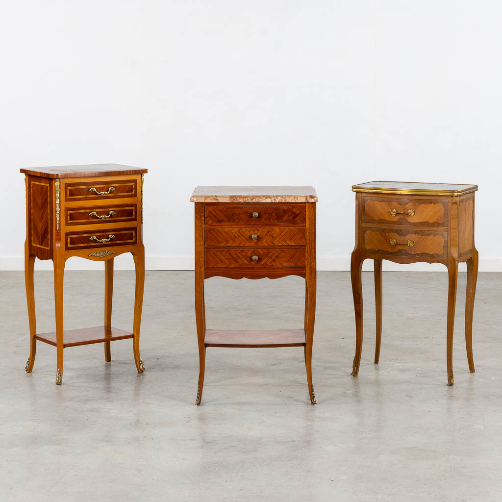 Three side tables, marquetry inlay. Two with a marble top. Circa 1980. (L:33 x W:42 x H:70 cm)