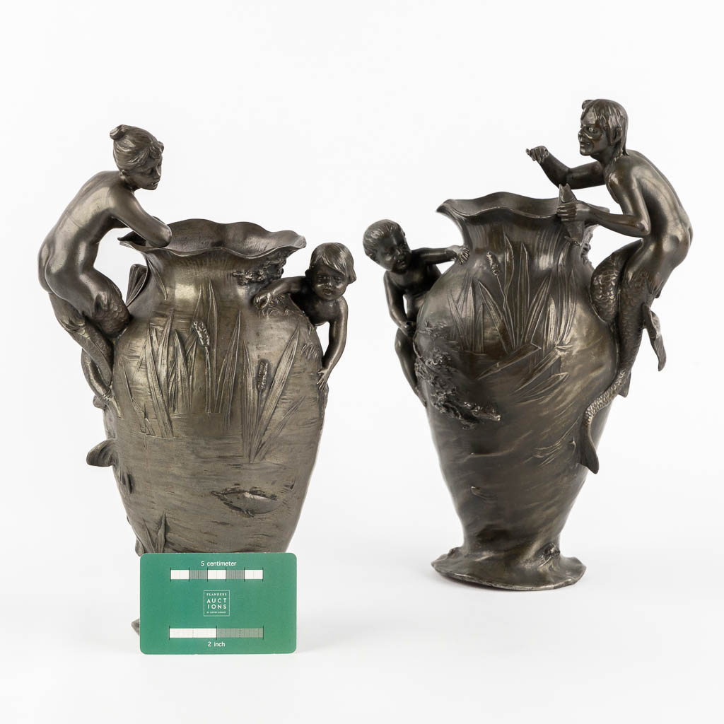 WMF, a pair of vases with playing children, a Mermaid and a Satyr, Art Nouveau, circa 1900. (L:13 x W:17 x H:29,5 cm)