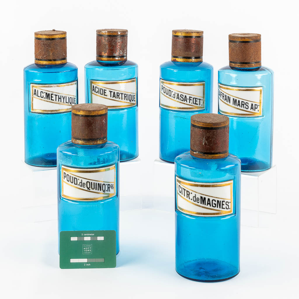 Six blue glass Pharmacy bottles with enamel plaques, circa 1880-1900. (H:23,5 x D:9,5 cm)