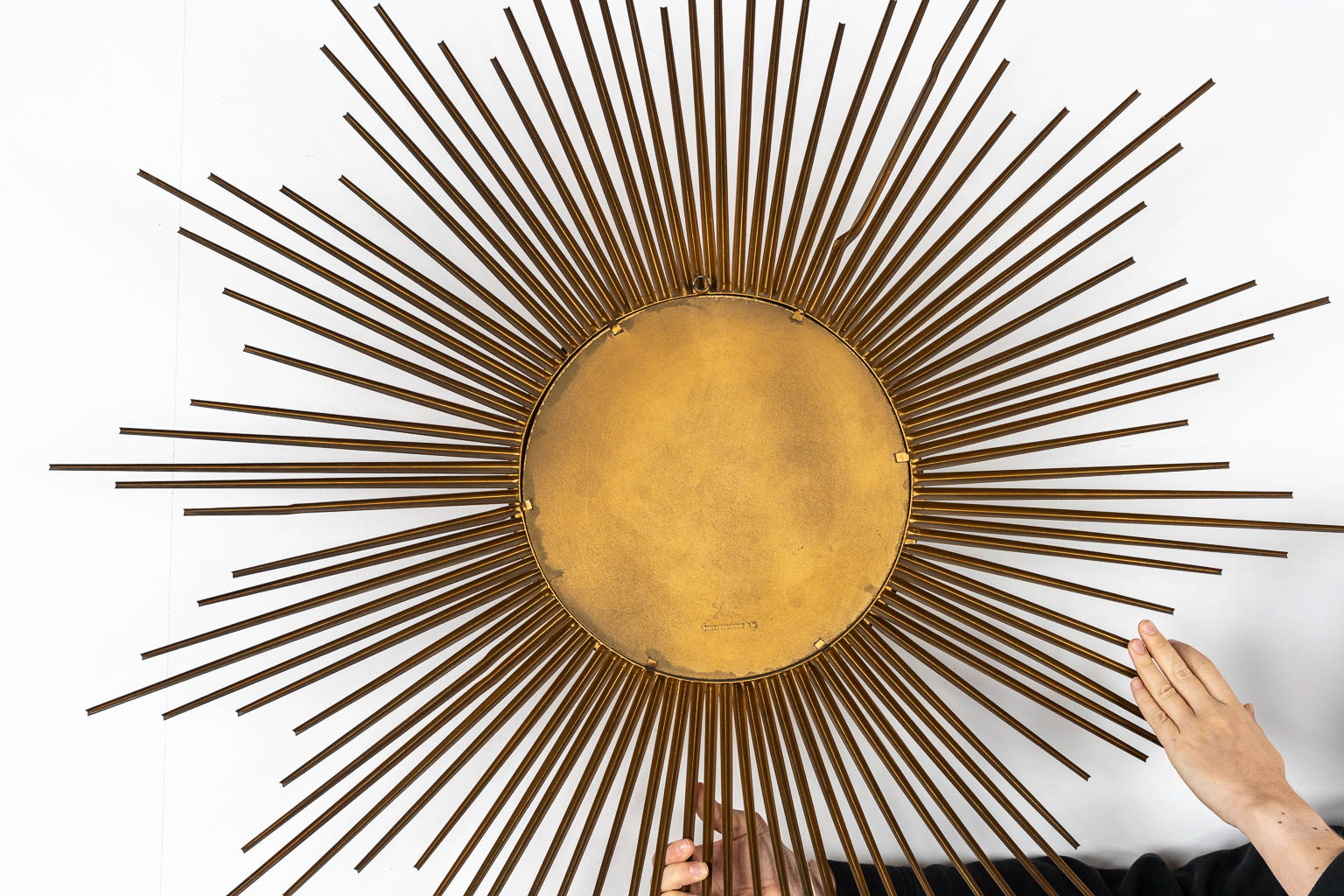 Chaty Vallauris, a large sunburst mirror. Gilt metal.  