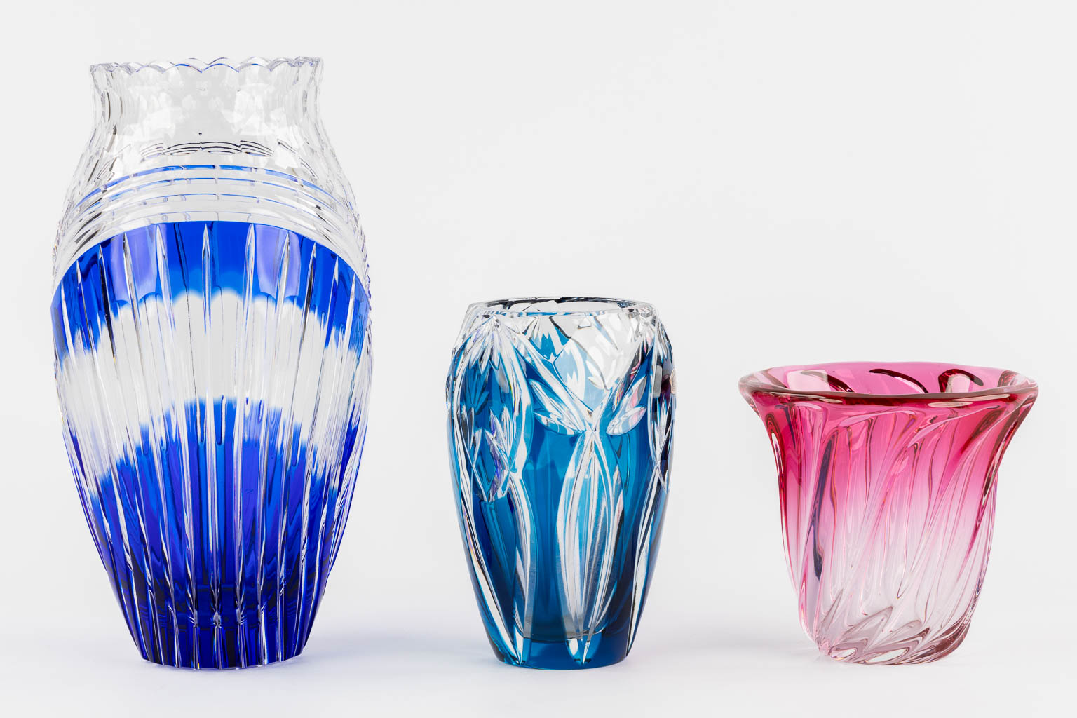 Val Saint Lambert, three coloured crystal vases. (H:29,5 x D:13,5 cm)