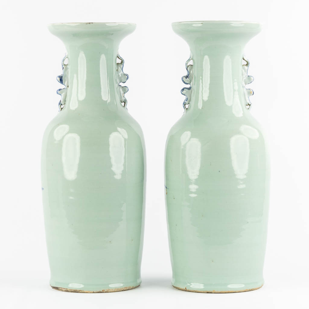 A pair of Chinese vases with a blue-white decor of playing children. (H:57,5 x D:21 cm)