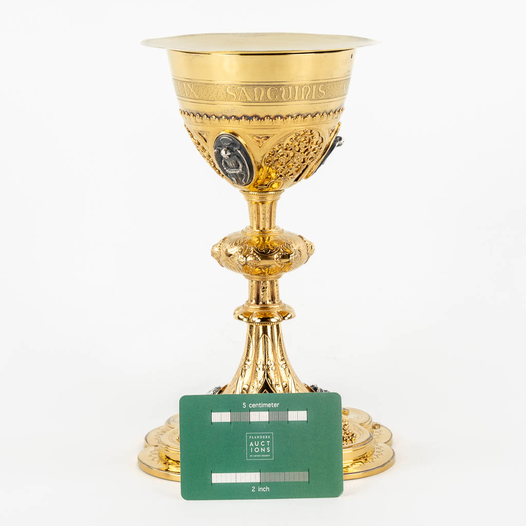 A Gothic Revival chalice with enamel plaques, cabochons. Silver Cuppa, Gilt brass, 19th C.