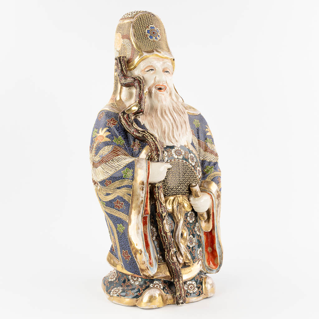 An Japanese figurine of a wise man, Satusma stoneware. (L:23 x W:29 x H:60 cm)