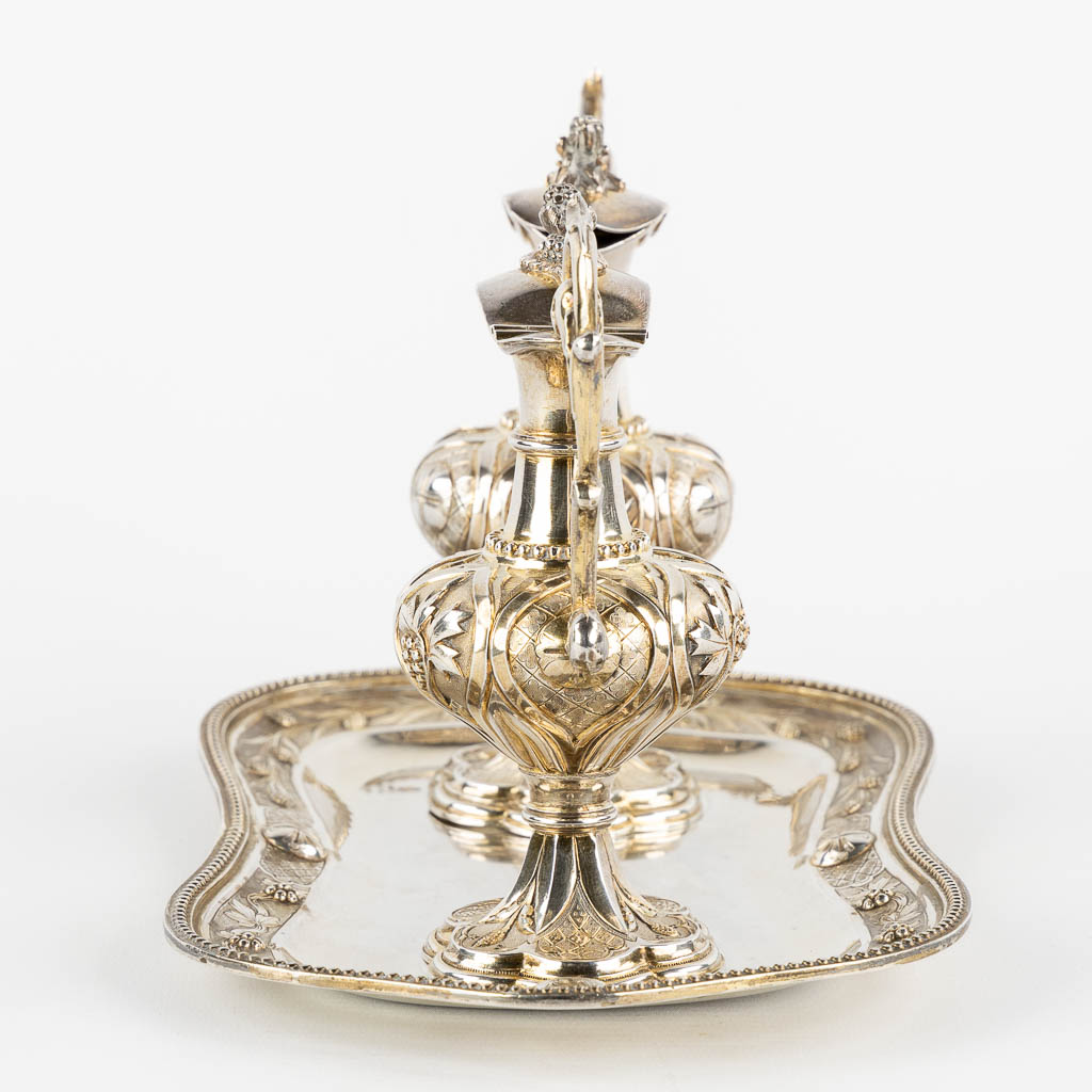 Joseph Dejean, Paris, a pair of wine and water cruets, silver, 1846-1865. 650g. (L:15 x W:26 x H:15 cm)