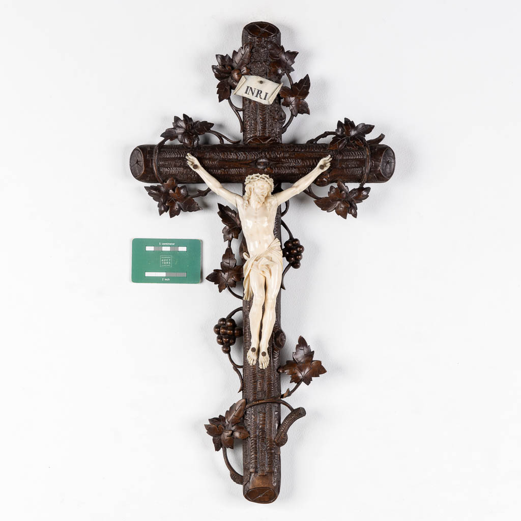 A wood-sculptured crucifix with an ivory 