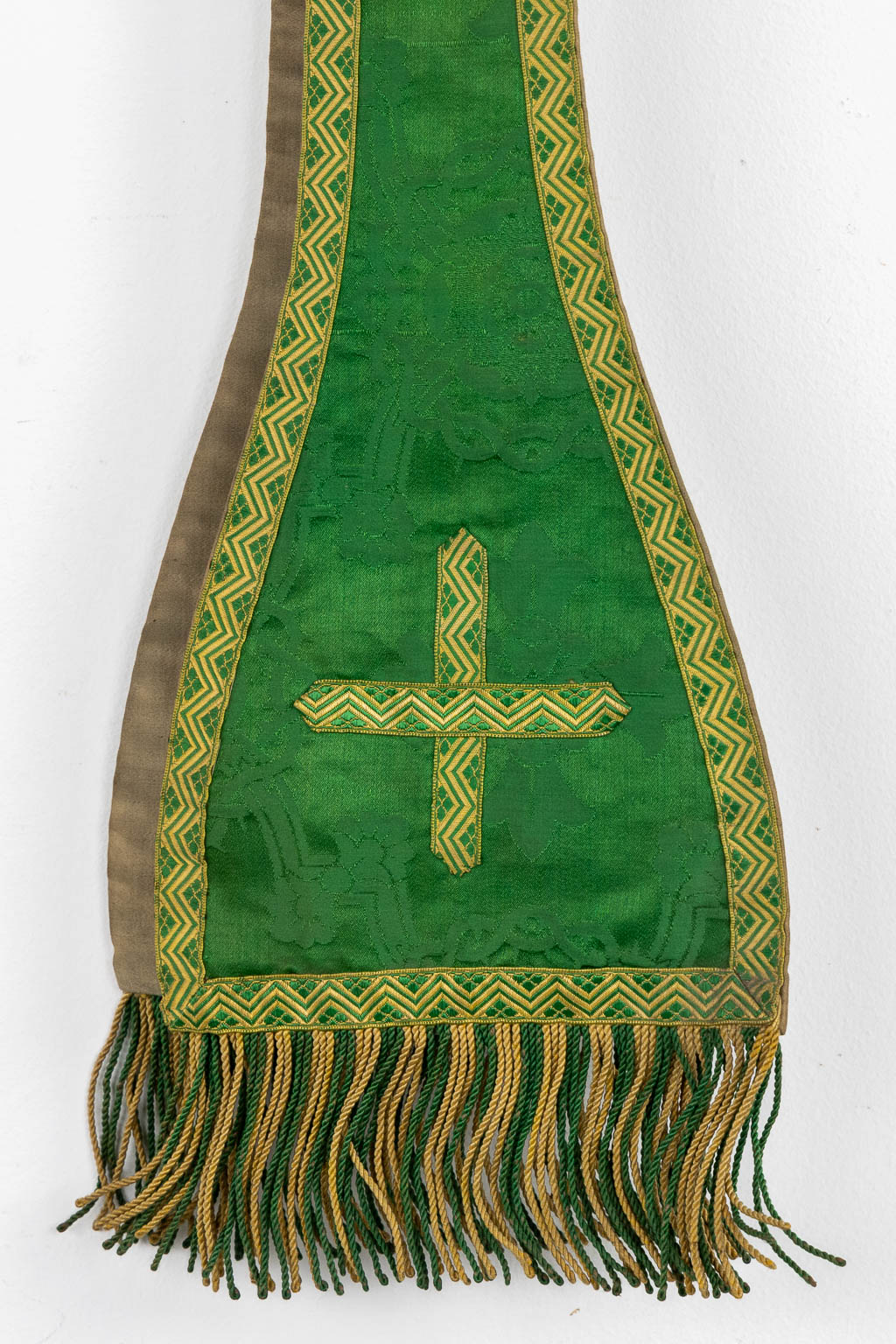 Two Dalmatics and a Roman Chasuble, added are a big collection of stola and maniple. 