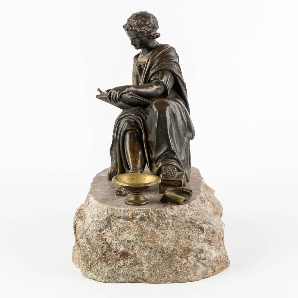 The Reading Roman, patinated bronze. 19th C. (L:23 x W:38 x H:34 cm)