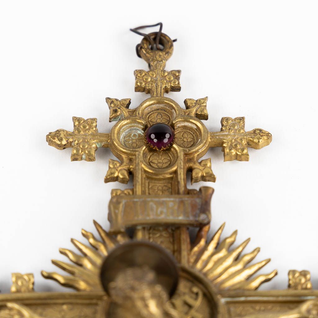 A crucifix, brass with cabochons, Gothic Revival. Circa 1900.