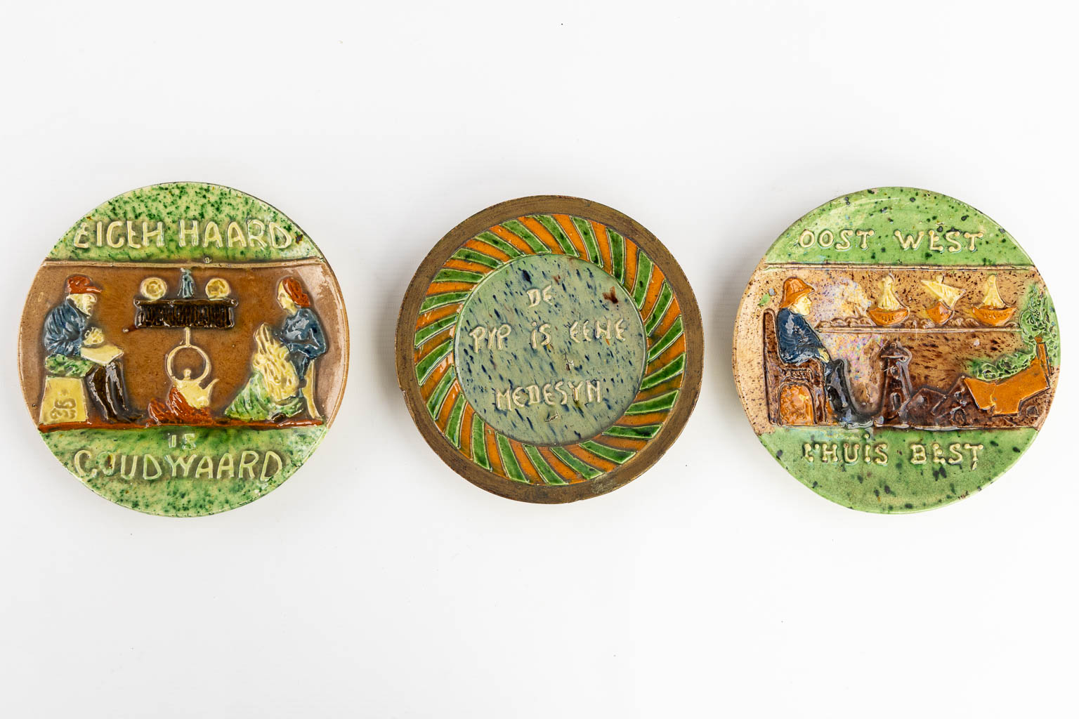 Eight plates with 'Proverbs and Sayings' made of Flemish Earthenware. 