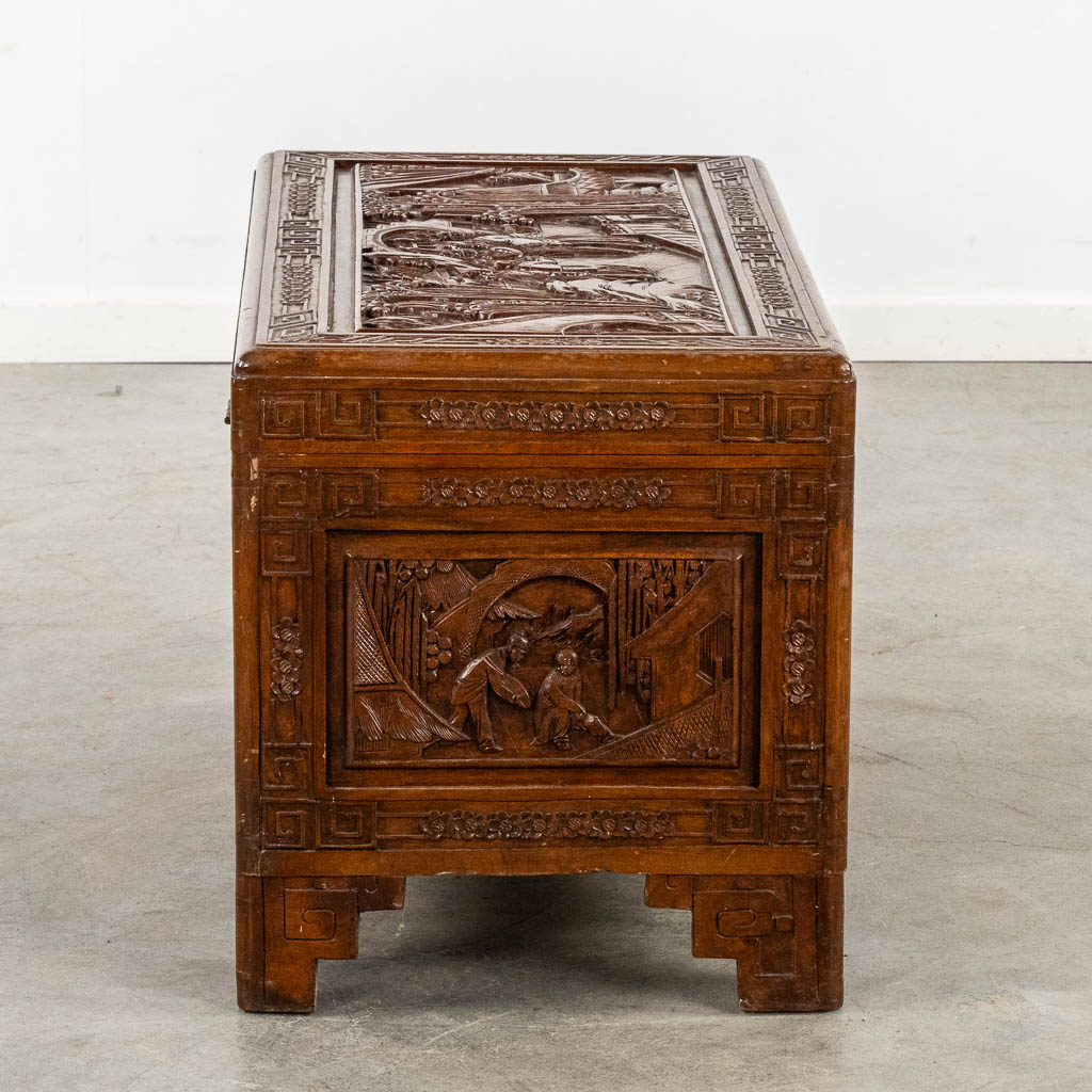 An Oriental sculptured chest, Camphor wood. (L:44 x W:89 x H:48 cm)