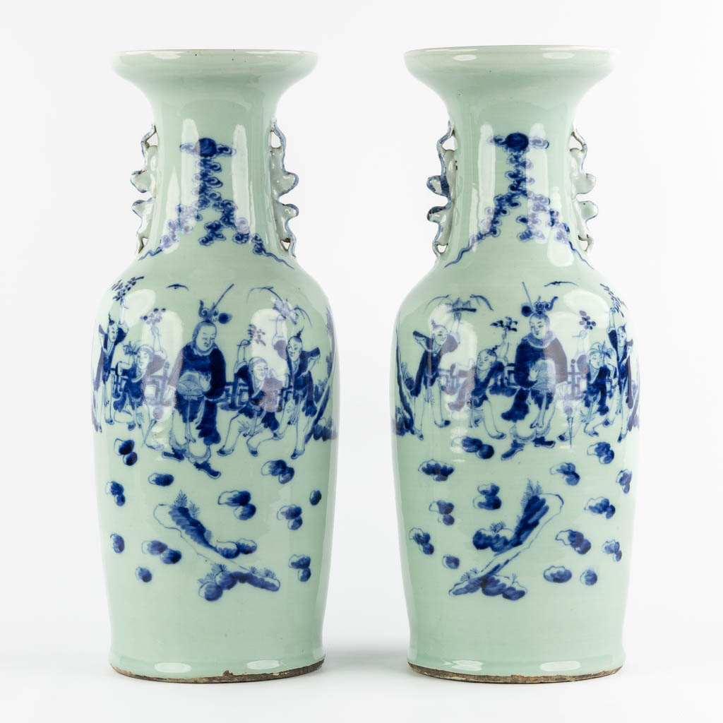 A pair of Chinese vases with a blue-white decor of playing children. (H:57,5 x D:21 cm)