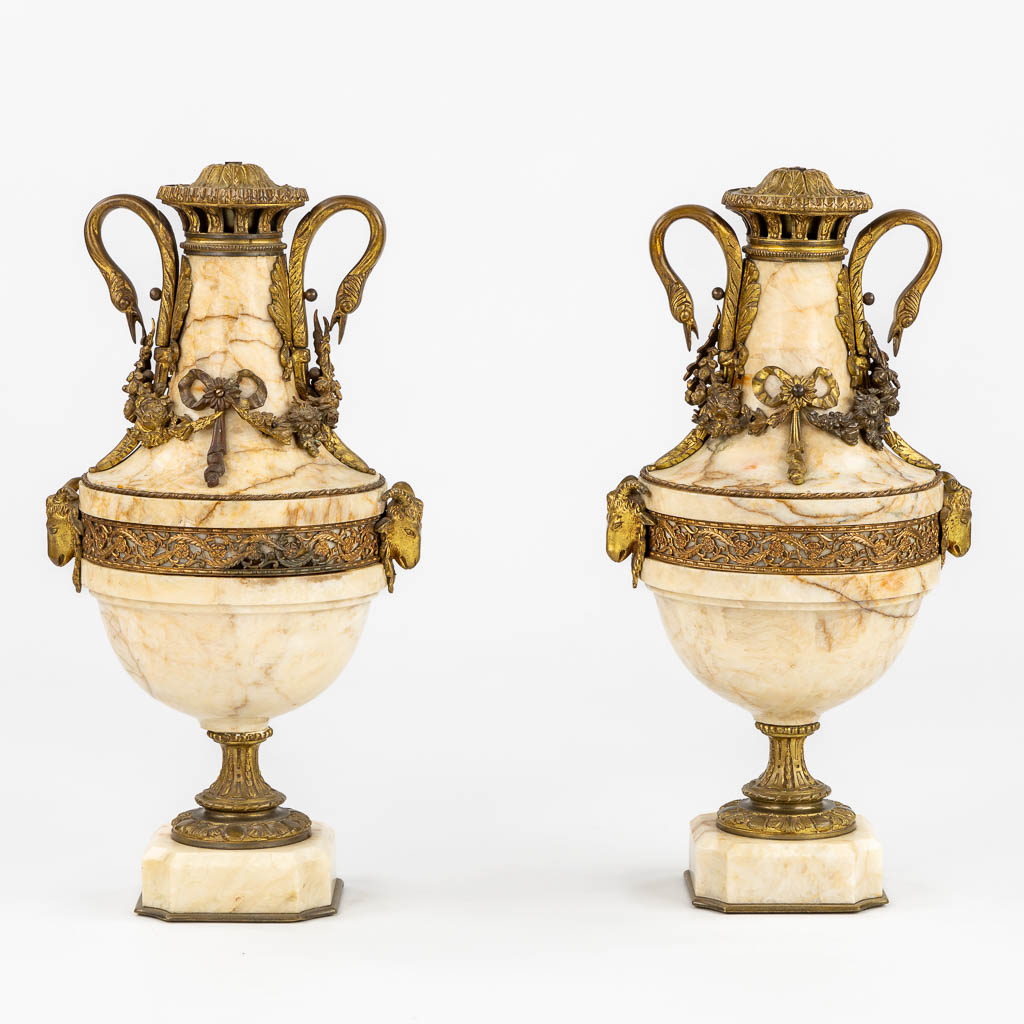 A pair of marble cassolettes, marble mounted with bronze in Louis XVI style. Ram