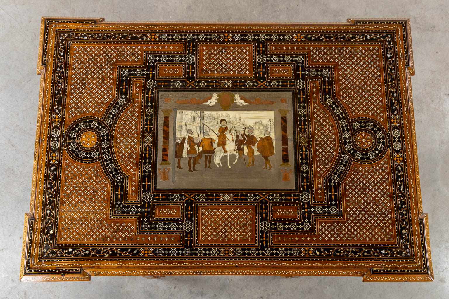 A Syrian table with two matching chairs, Marquetry and copper inlay, 19th C. (L:87 x W:121 x H:80 cm)