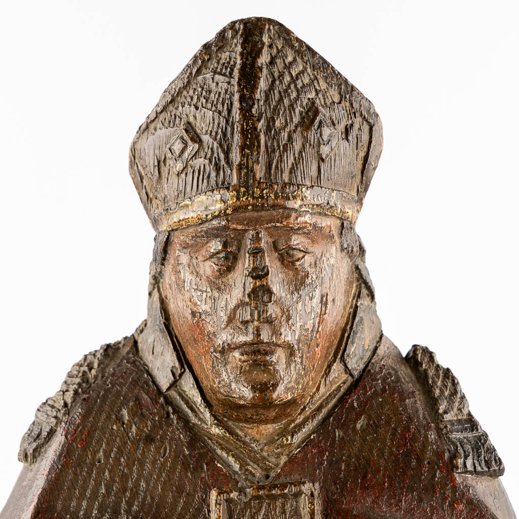 An antique wood-sculptured figurine of Saint Hubert of Liège, 17th/18th C.