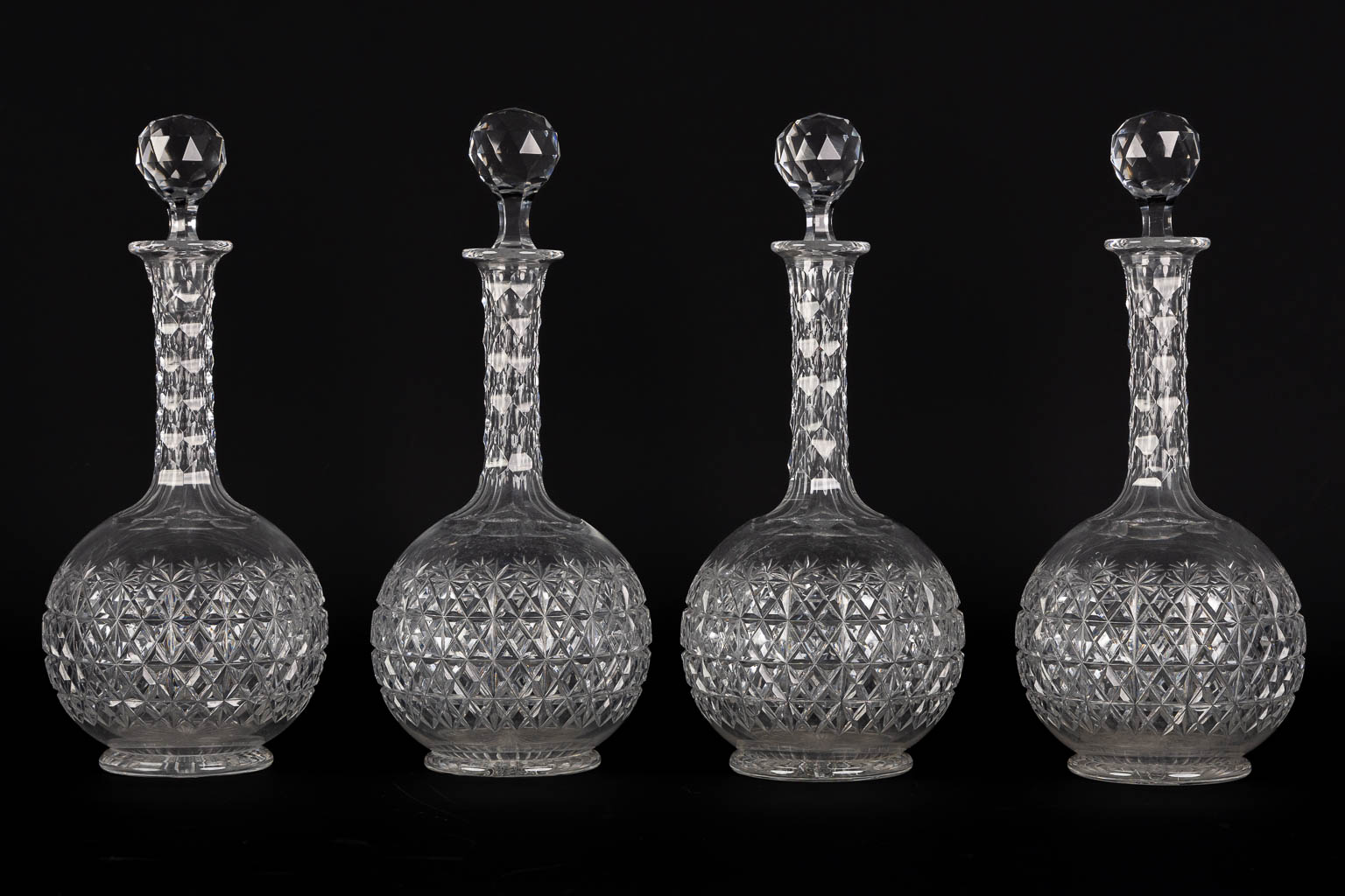 A matching set of 8 caraffes, added are a pair. Cut crystal. (H:34 cm)