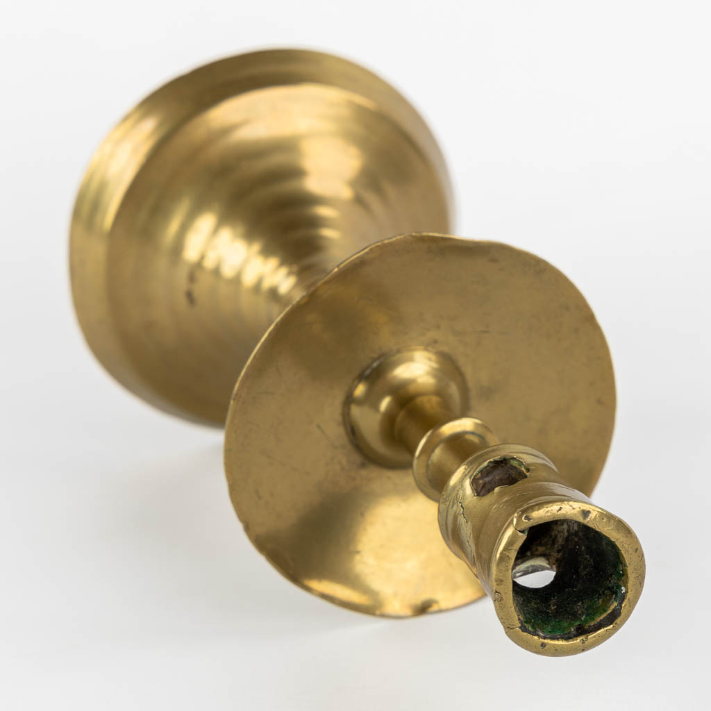 A brass disk candlestick, so-called 