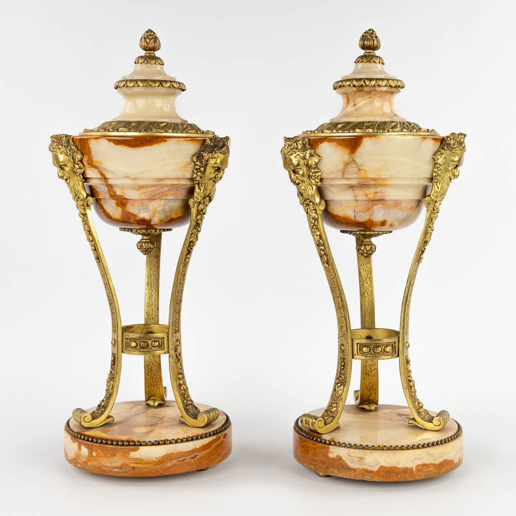 A pair of cassolettes, onyx mounted with bronze in Louis XVI style. Circa 1900. (H:45 x D:18 cm)