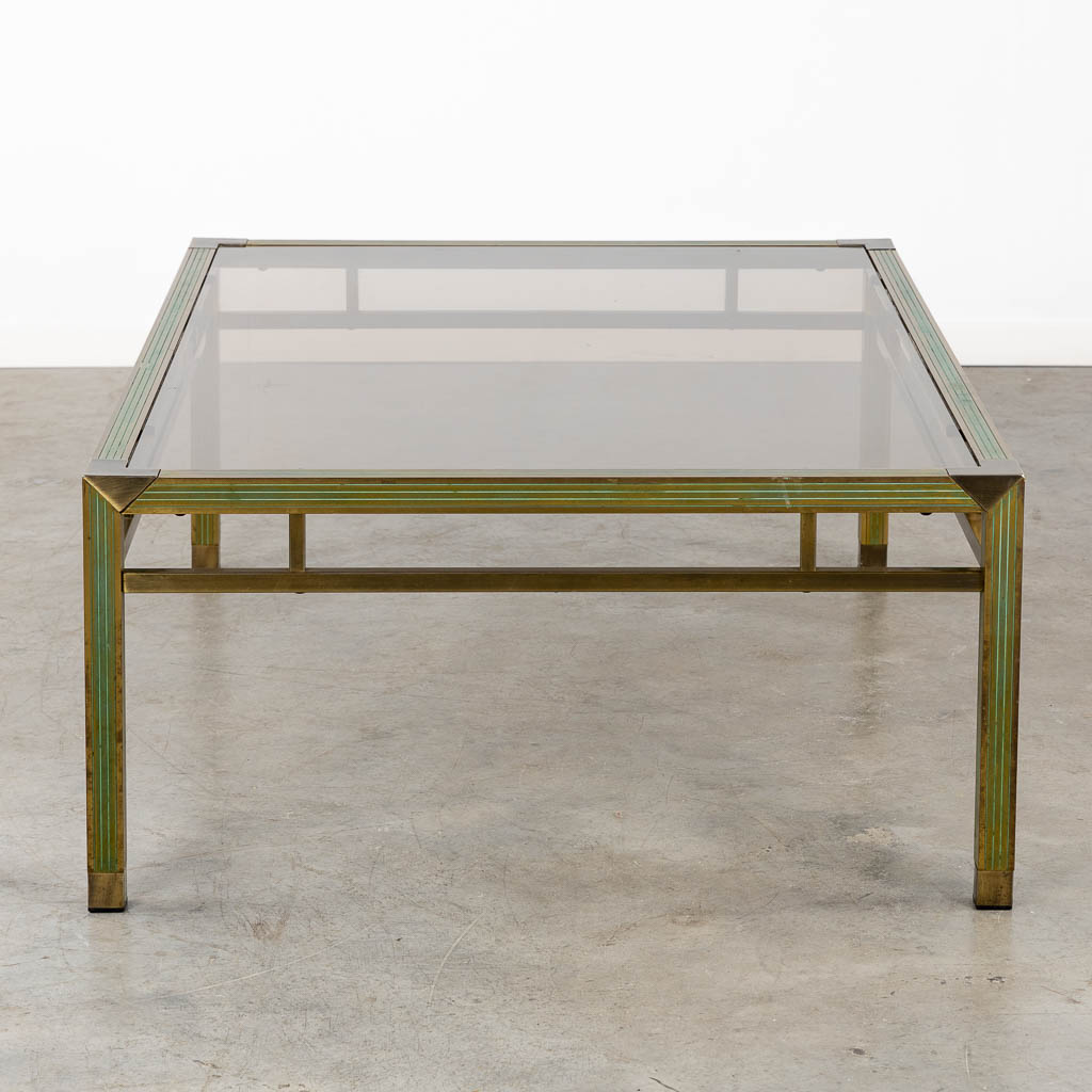 A mid-century coffee table, brass and glass in the style of Belgo Chrome. (L:88 x W:128 x H:43 cm)