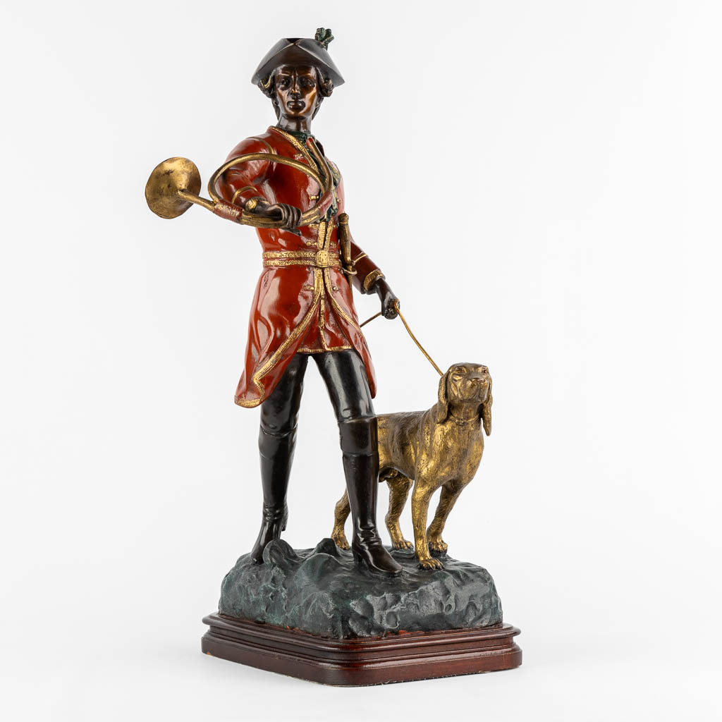 After Pierre Jules Mène, Hunter with his horn and dog. Patinated bronze. (L:29 x W:35 x H:62 cm)