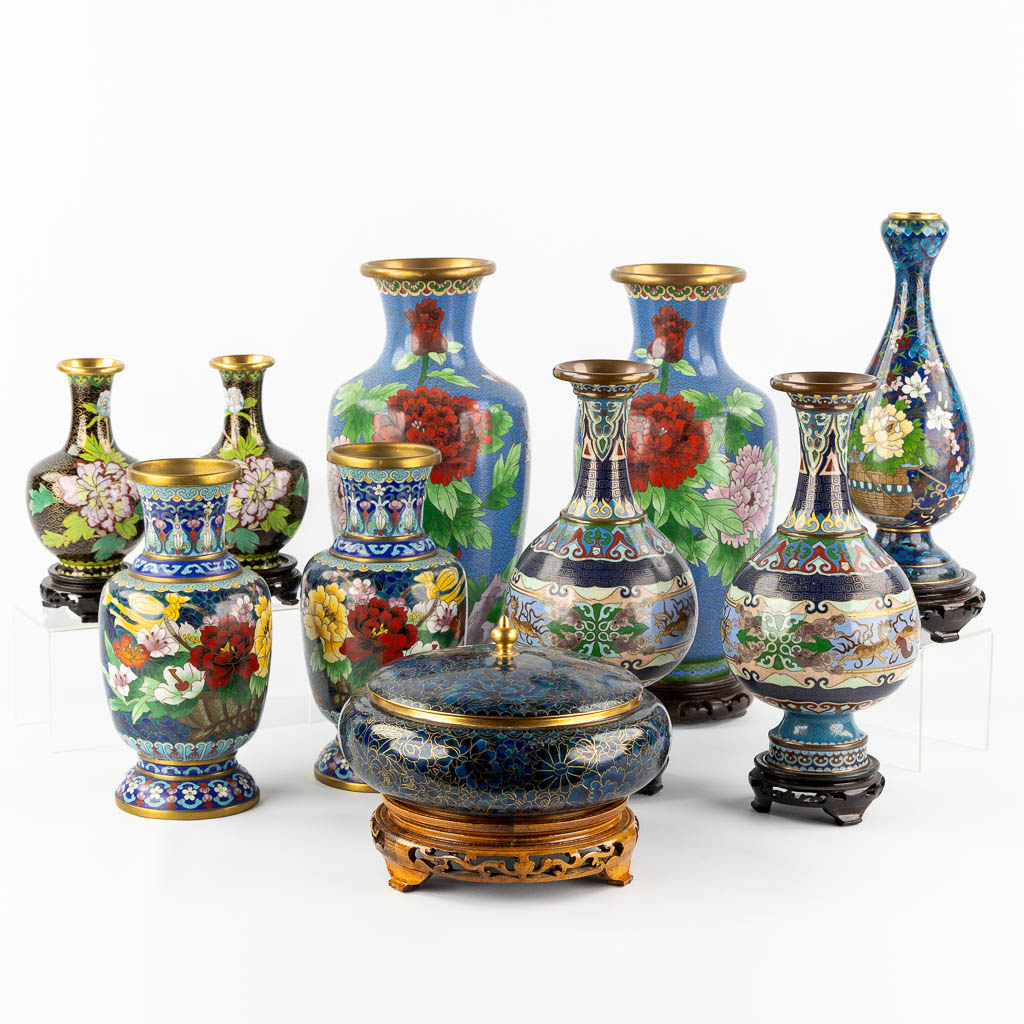 Ten Oriental cloisonné vases and a bowl with a lid. 20th C.