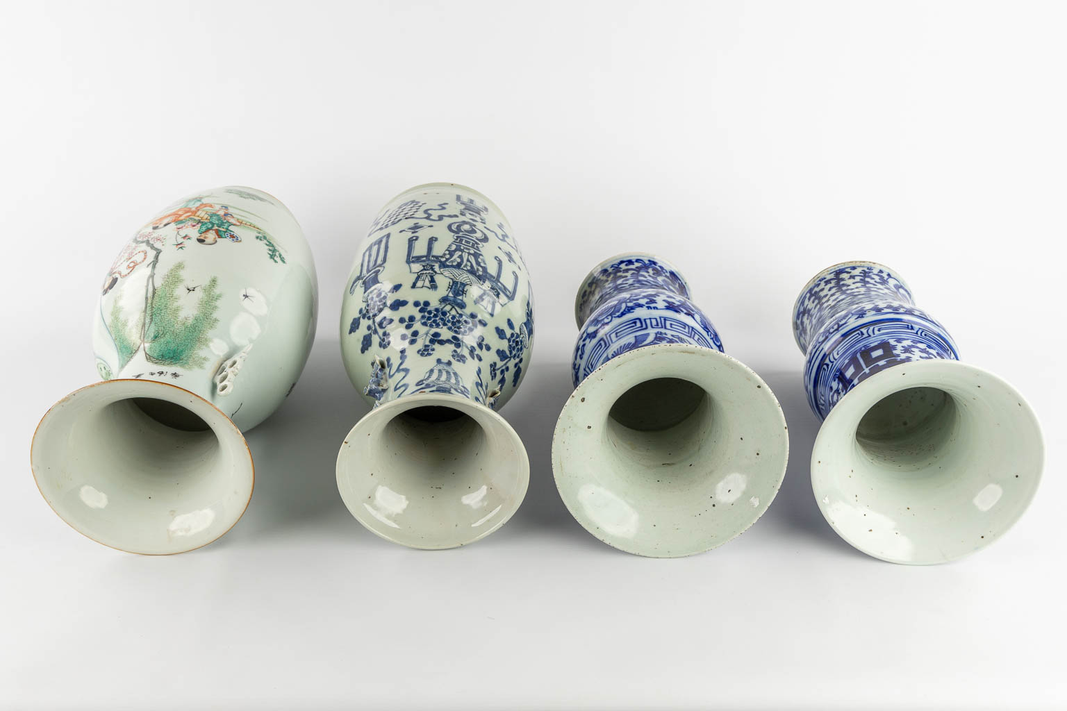 Four Chinese vases, blue white and polychrome. 