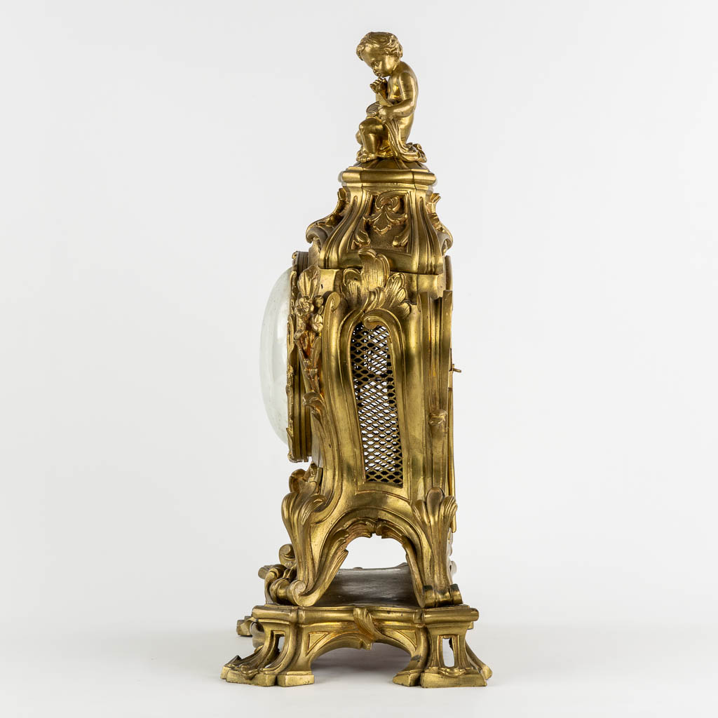 A large mantle clock, bronze, Louis XV style. 19th C. (L:22 x W:38 x H:56 cm)