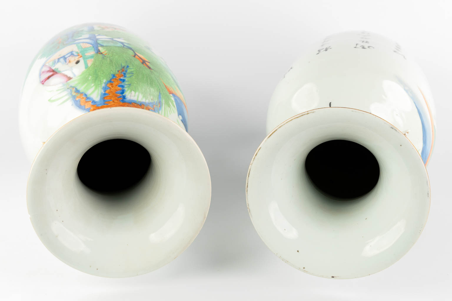 A pair of Chinese vases, decorated with playing children and kaligraphic texts. (H:59 x D:23 cm)