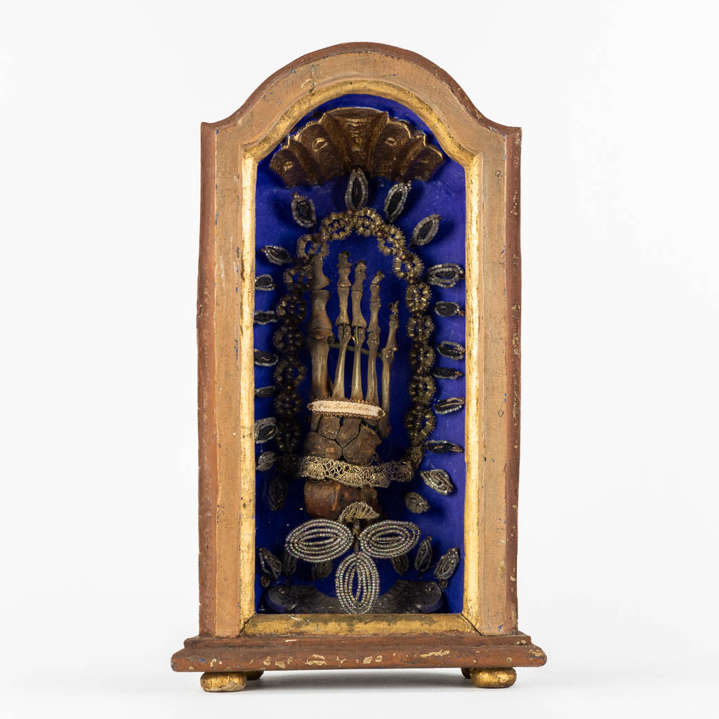 A reliquary cabinet with a relic of a foot, VM. Bach Cedron, dated 1768.