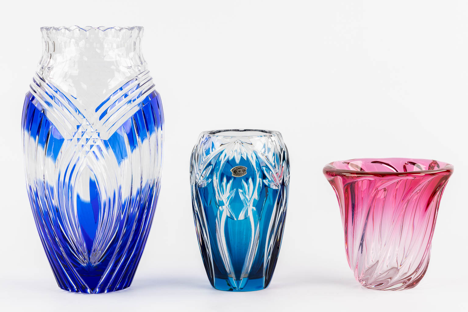 Val Saint Lambert, three coloured crystal vases. (H:29,5 x D:13,5 cm)